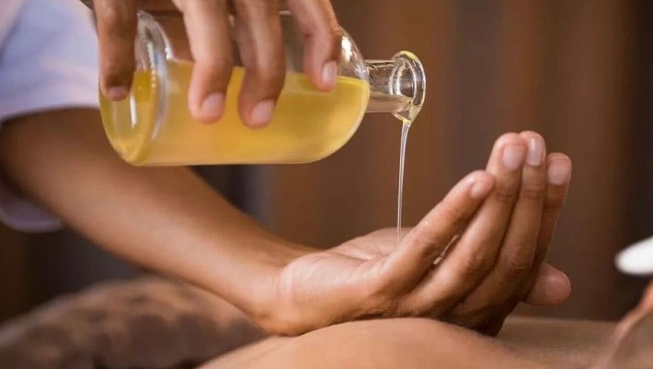 Massage oil being poured at Dee’s Spa Relaxation, Nassau, New Providence, BS.