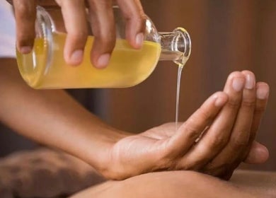 Massage oil being poured at Dee’s Spa Relaxation, Nassau, New Providence, BS.