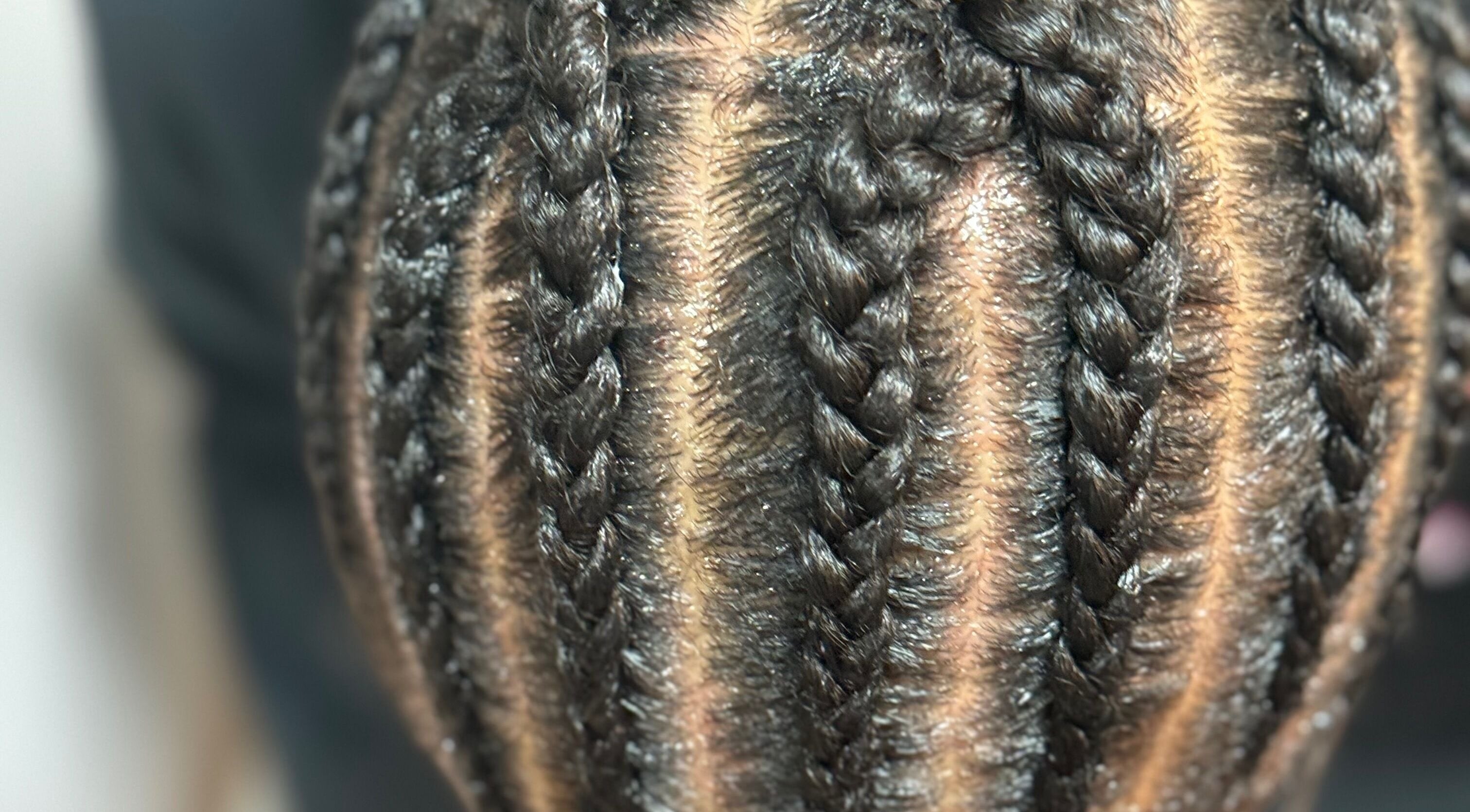Close-up of intricate braids at Jazz at Blue Hair Vibes Studio, Temecula, California, US.