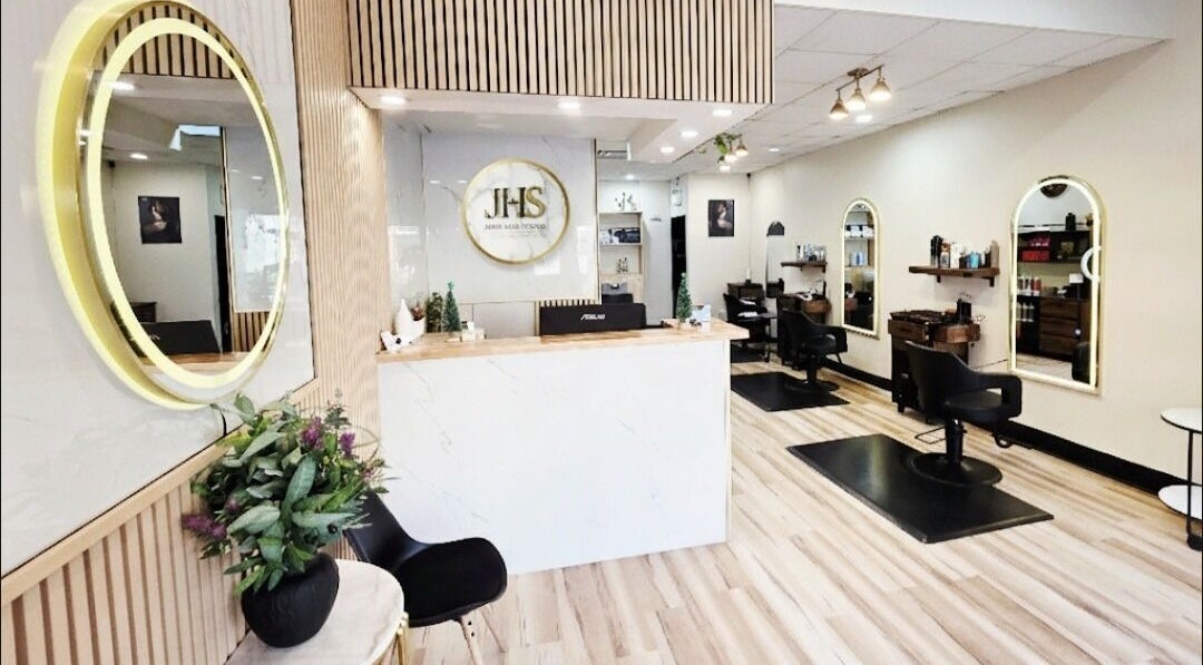Modern interior of Jimmy Hair Studio in Kingston, Ontario, CA with stylish decor and salon chairs.