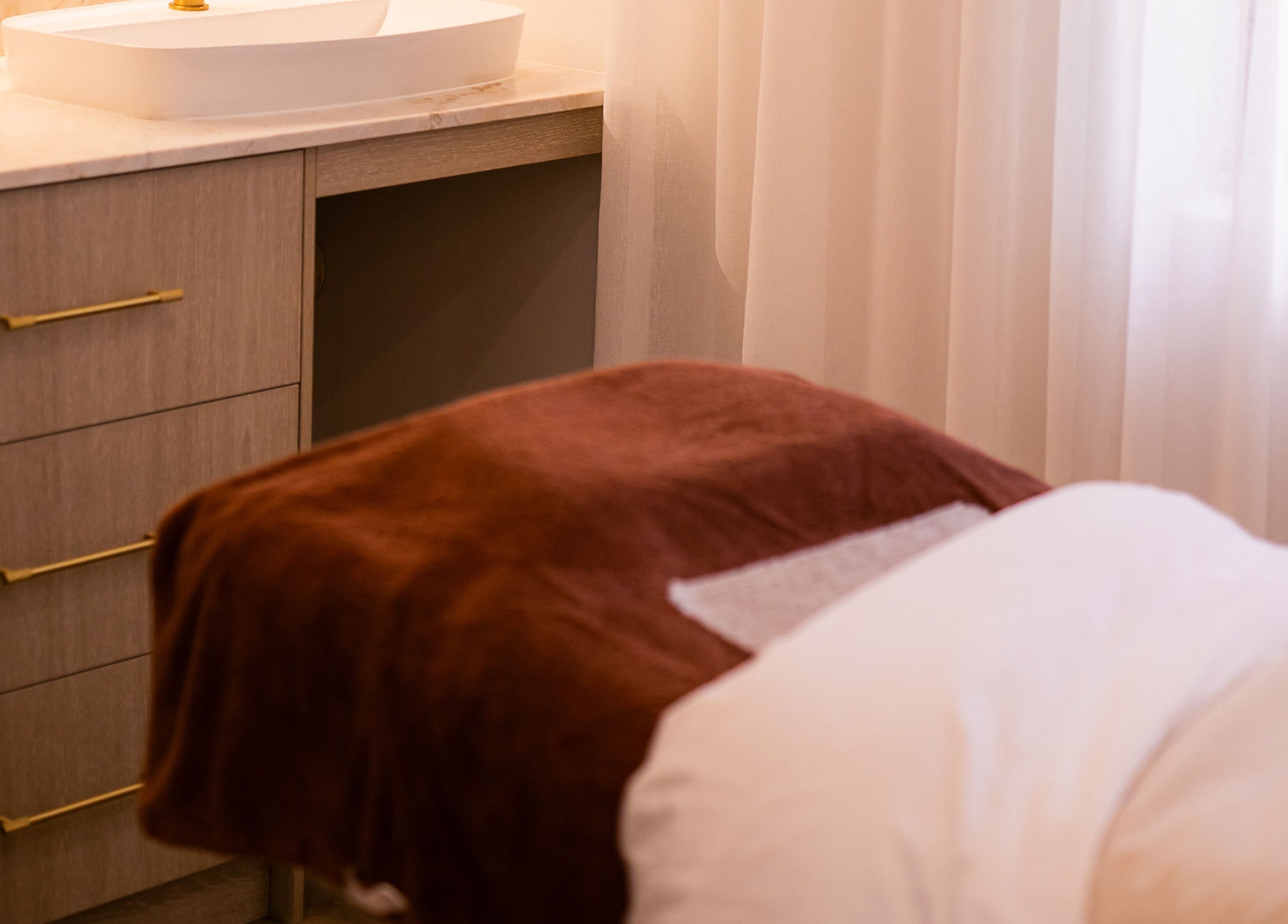 Relaxing treatment room at Surskin, Perth, Western Australia, AU with a comfortable massage bed.