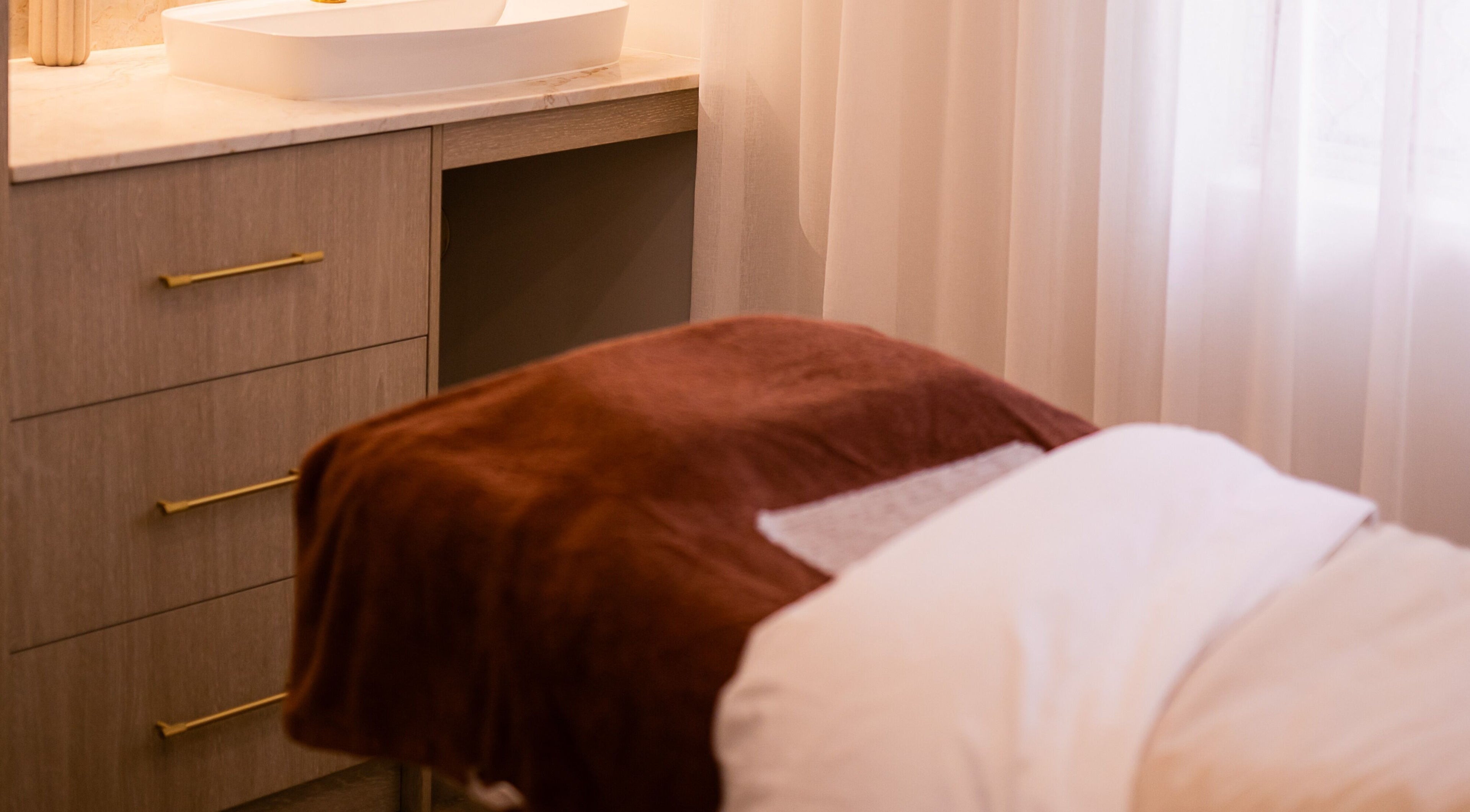 Relaxing treatment room at Surskin, Perth, Western Australia, AU with a comfortable massage bed.