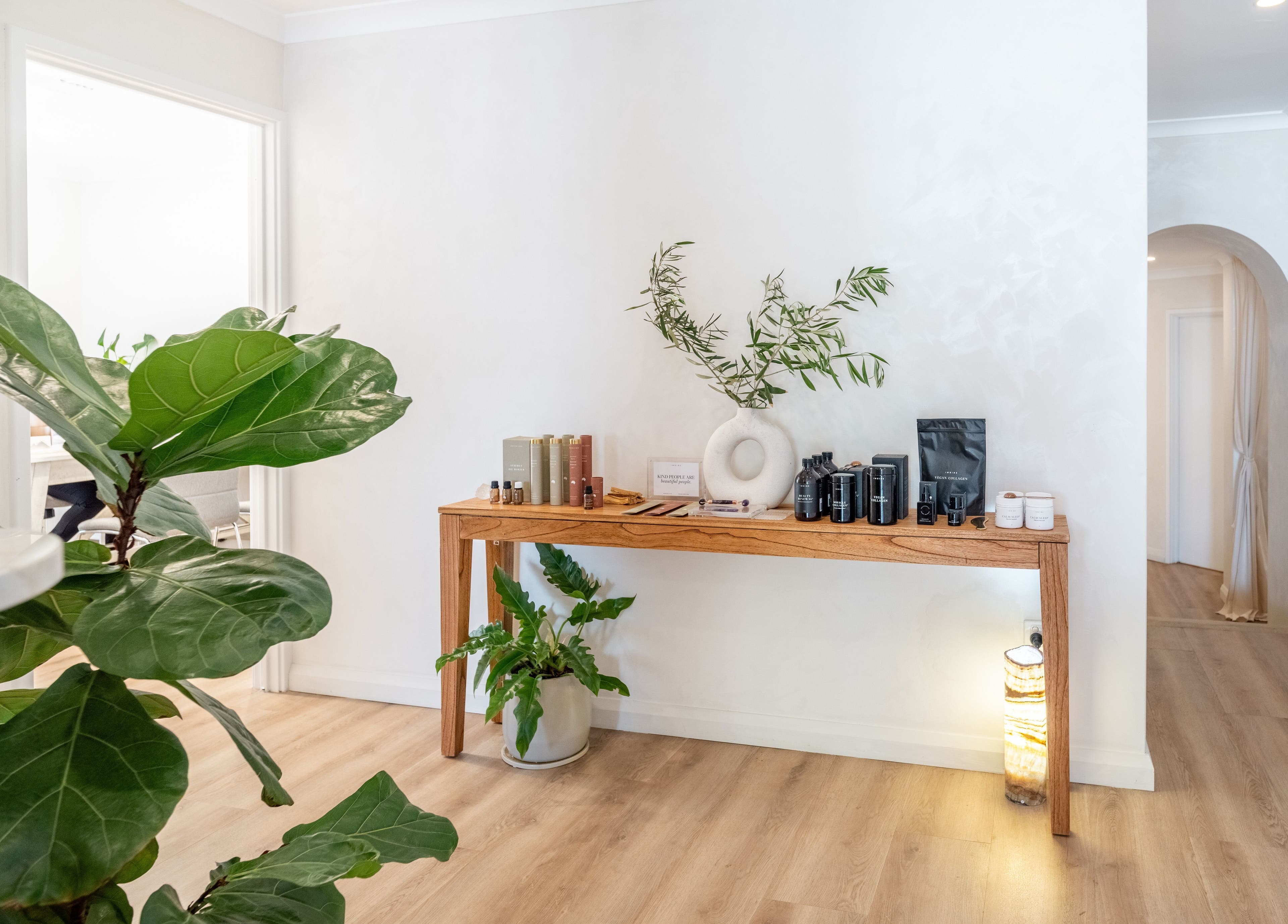 Elegant wooden table with beauty products at Surskin, Perth, Western Australia, AU showcasing a serene ambiance.