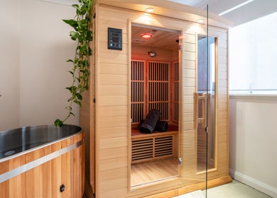 Relaxing sauna room at Henosis & Co, Perth, Western Australia, AU with natural wood and calming plants.