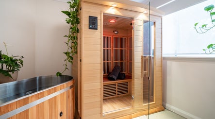 Relaxing sauna room at Henosis & Co, Perth, Western Australia, AU with natural wood and calming plants.