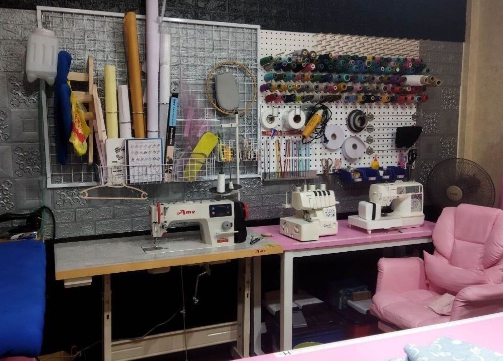 Heartfitted Sewing and Alterations workspace in Kuching, Sarawak, MY, featuring a sewing machine and crafting tools.
