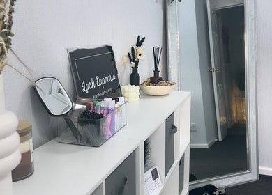 Chic decor at Lash Euphoria in Inverness, Scotland, GB, featuring stylish shelving and a tall mirror.
