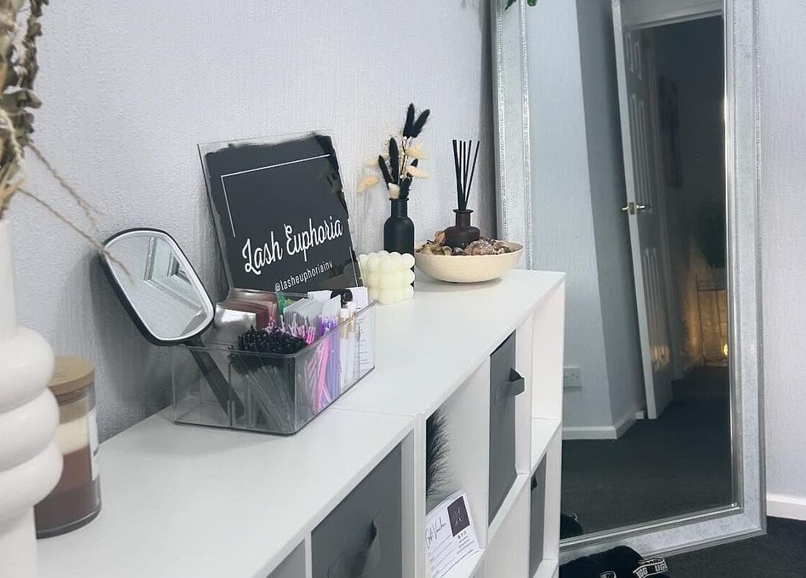 Elegant interior of Lash Euphoria in Inverness, Scotland, GB, featuring chic decor and mirror reflecting calm ambiance.