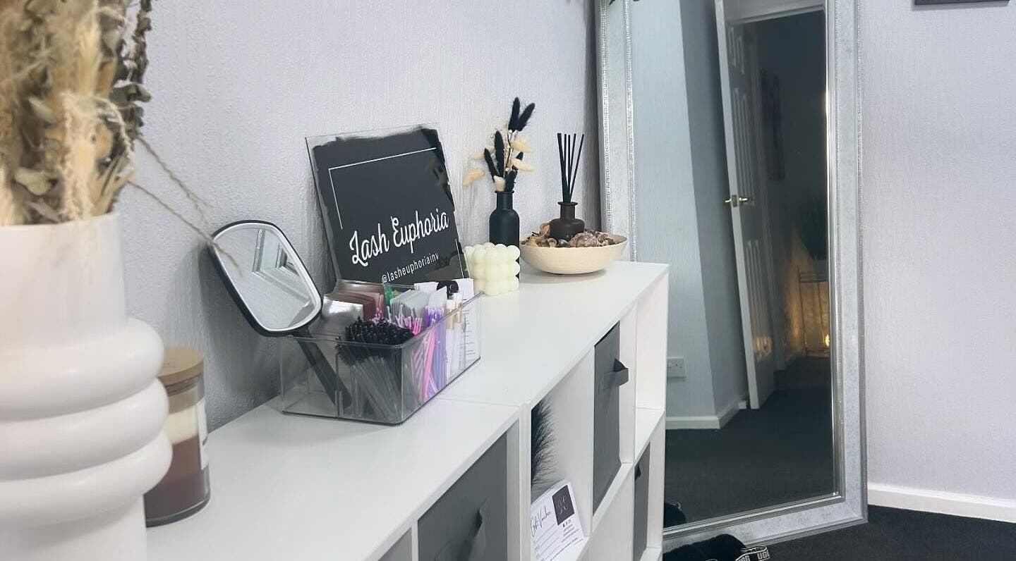 Elegant interior of Lash Euphoria in Inverness, Scotland, GB, featuring chic decor and mirror reflecting calm ambiance.