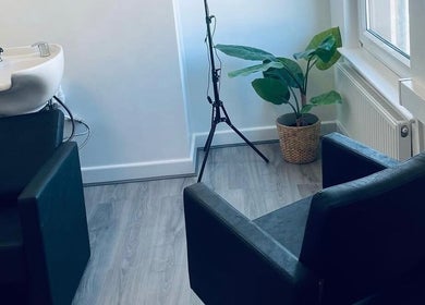 Modern wash station at Paije Love Hair in Rainhill, England, GB with sleek decor and natural light.