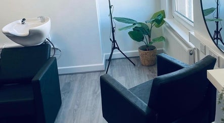 Modern wash station at Paije Love Hair in Rainhill, England, GB with sleek decor and natural light.