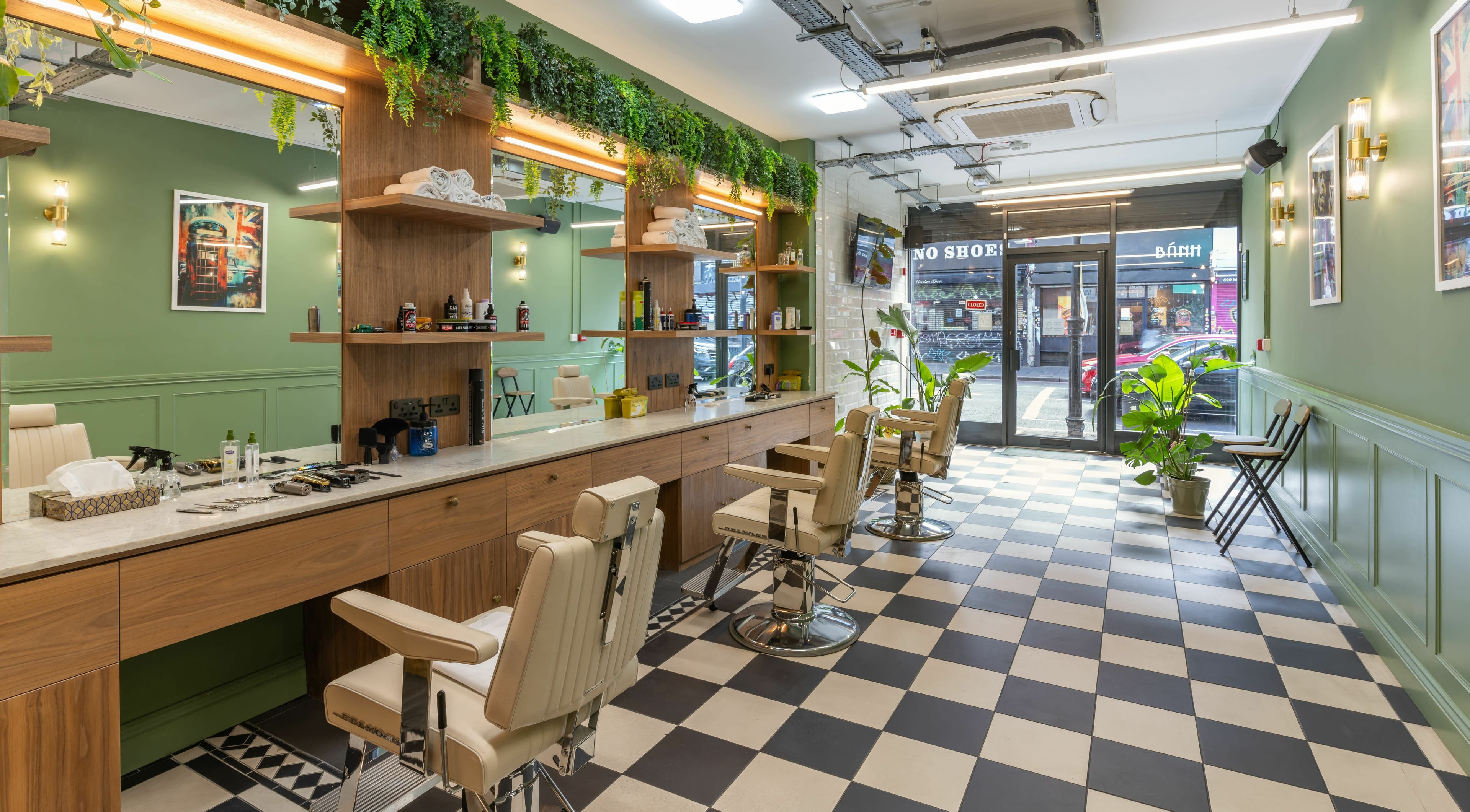 Interior of The Axe Club - Dalston in London, England, GB, showcasing stylish barber chairs and modern decor.