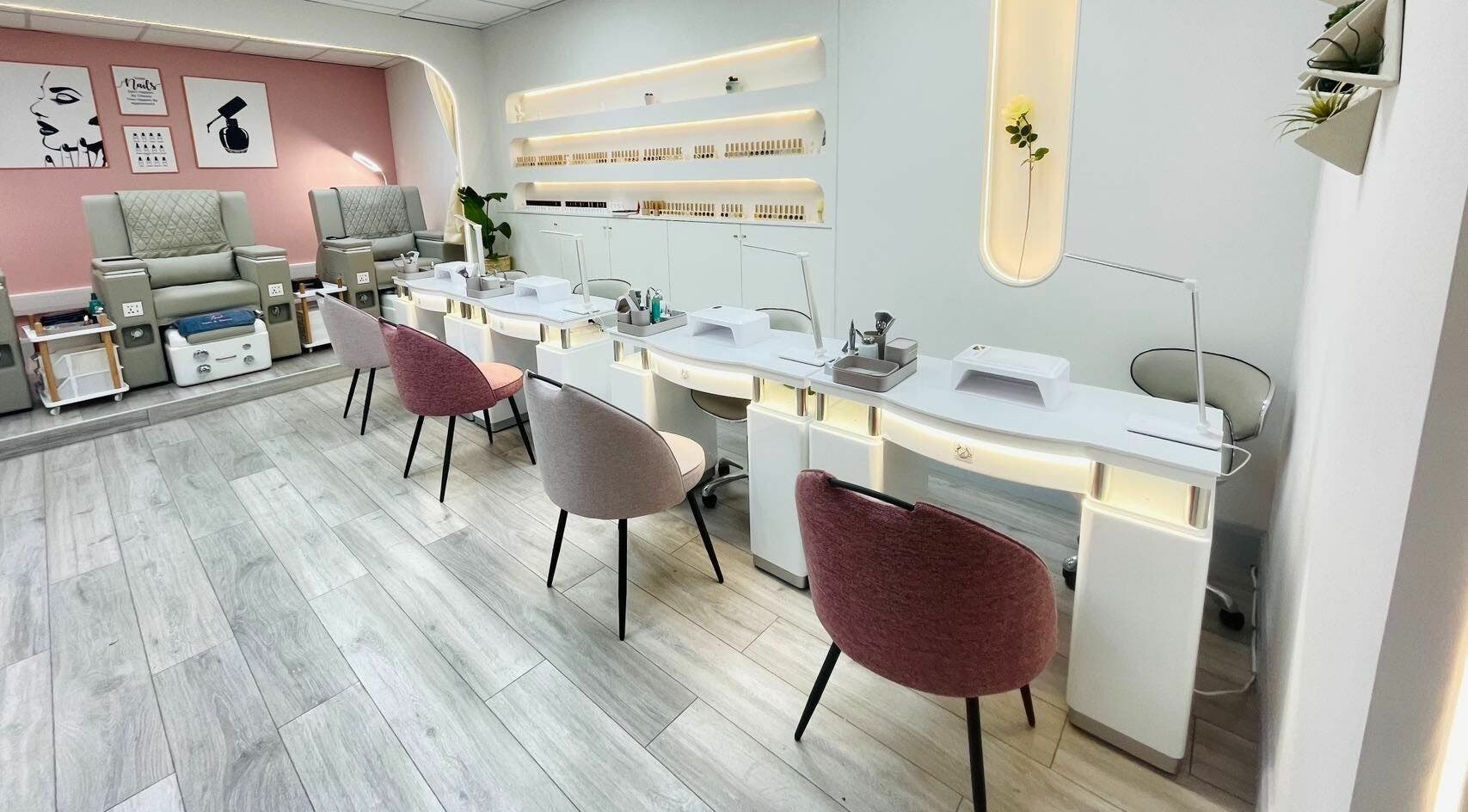 Modern nail salon interior at Truli Nails Beauty, Dublin, County Dublin, IE featuring plush chairs and chic decor.