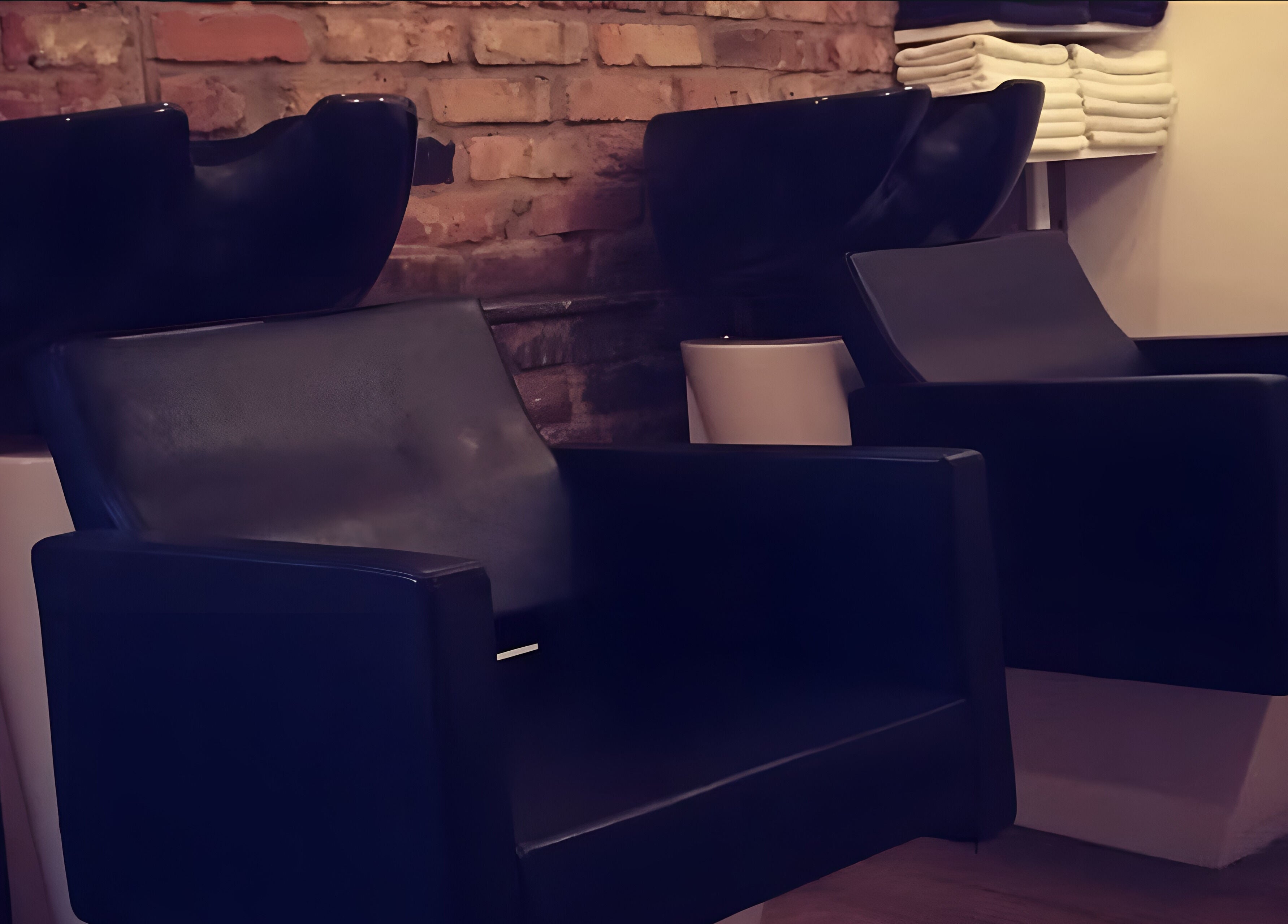 Comfortable salon chairs at Nelly McNally in Southend-on-Sea, England, GB, offering a relaxing beauty experience.