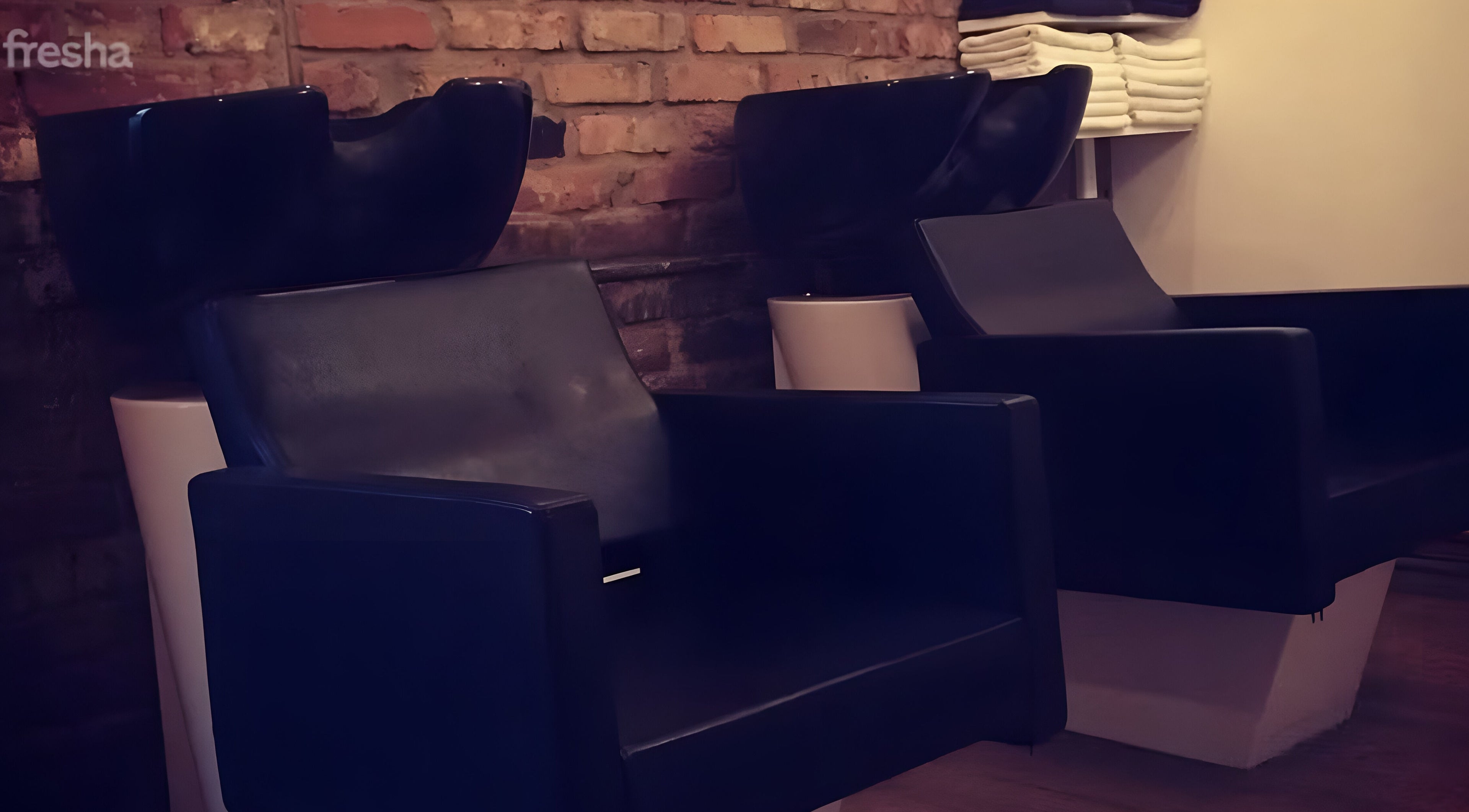 Comfortable salon chairs at Nelly McNally in Southend-on-Sea, England, GB, offering a relaxing beauty experience.