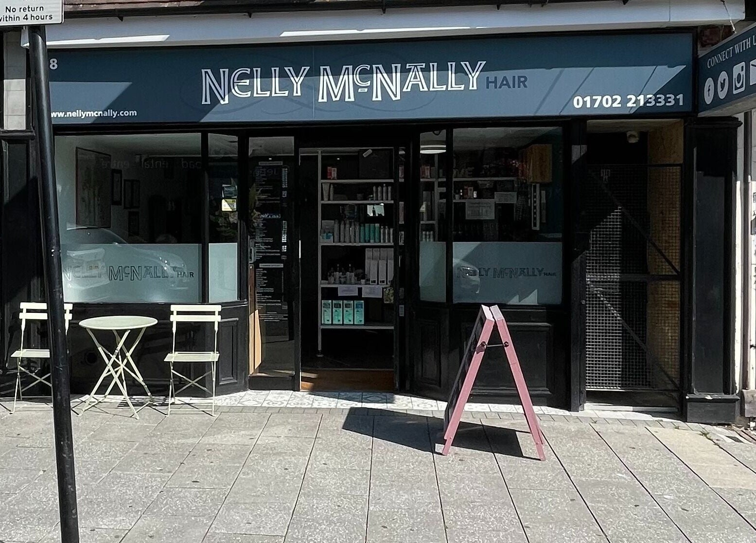 Nelly McNally salon exterior at Southend-on-Sea, England, GB with a stylish facade and outdoor seating.