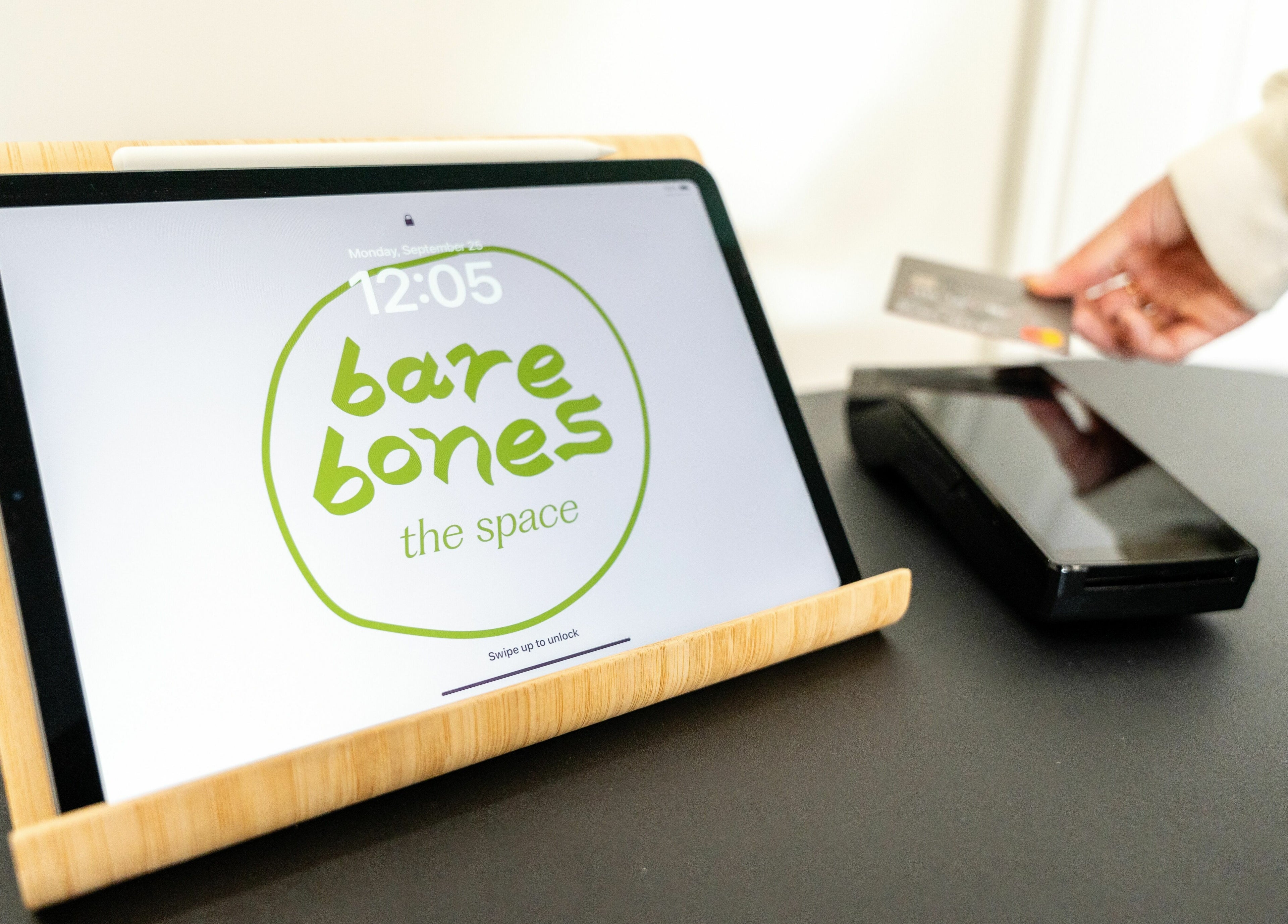 Digital payment setup at Bare Bones The Space, Toronto, Ontario, CA showcasing on-screen logo.