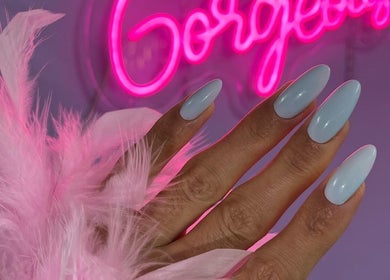 Elegant nail art at Russian Manicure. Awesome Nail Studio, New York, US, with pink neon sign.