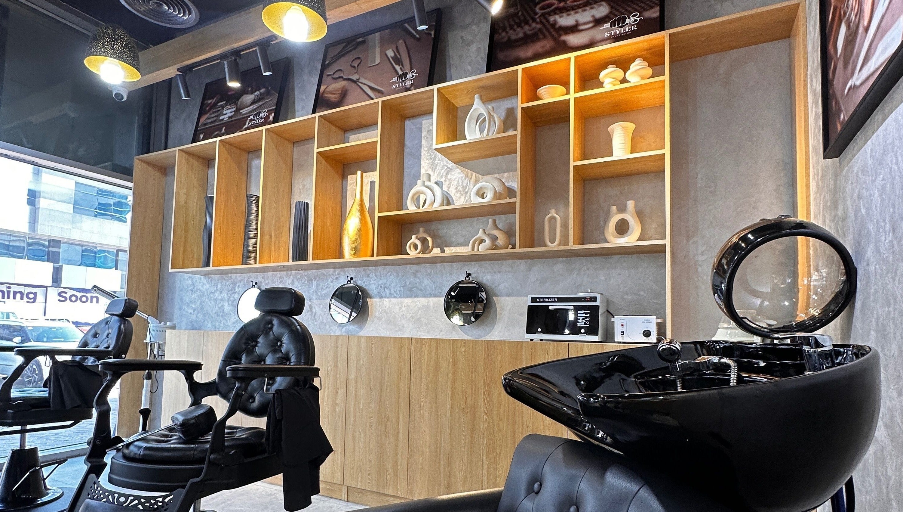 Modern salon chairs and decor at Styler Gents Salon & Spa - Khalifa Park, Abu Dhabi, AE.