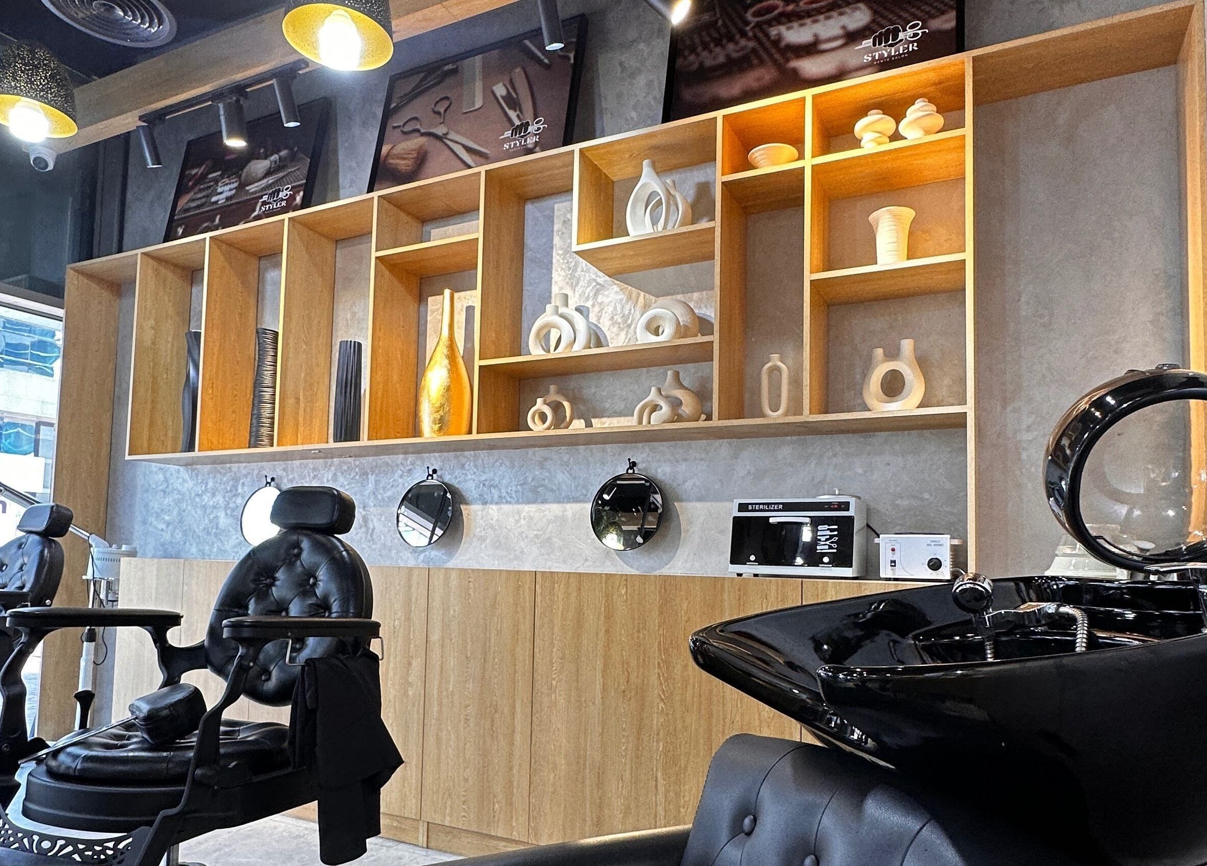 Modern salon chairs and decor at Styler Gents Salon & Spa - Khalifa Park, Abu Dhabi, AE.