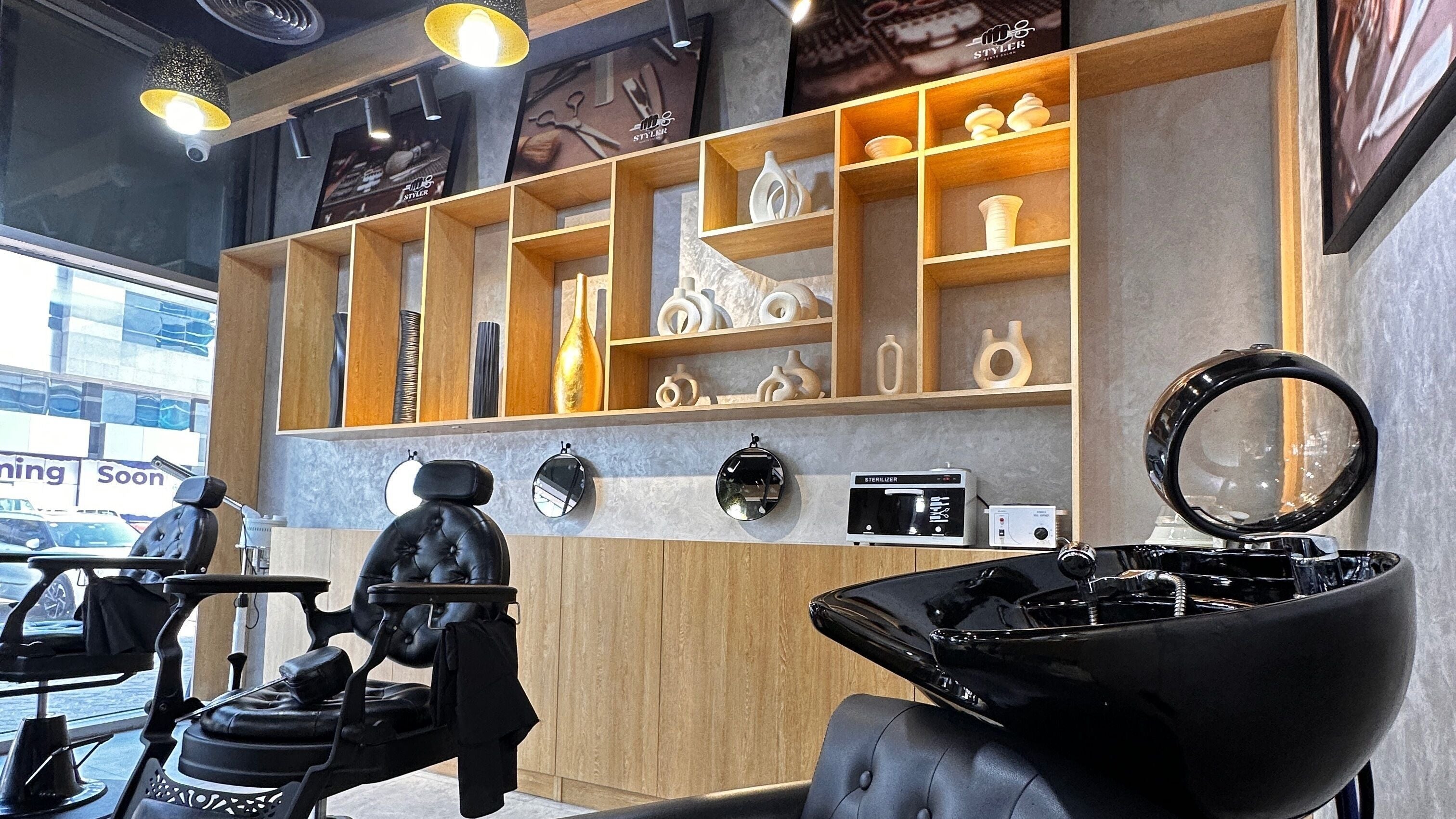 Modern salon chairs and decor at Styler Gents Salon & Spa - Khalifa Park, Abu Dhabi, AE.