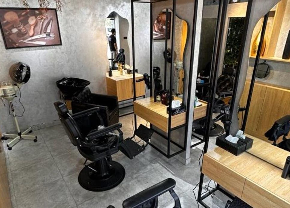 Styler Gents Salon & Spa - Khalifa Park interior showcasing stylish chairs and mirrors, Abu Dhabi, AE.