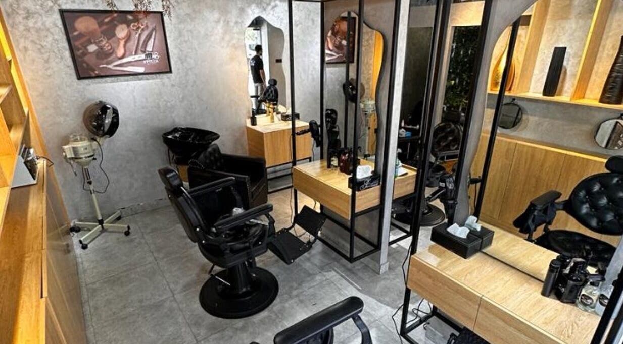 Styler Gents Salon & Spa - Khalifa Park interior showcasing stylish chairs and mirrors, Abu Dhabi, AE.