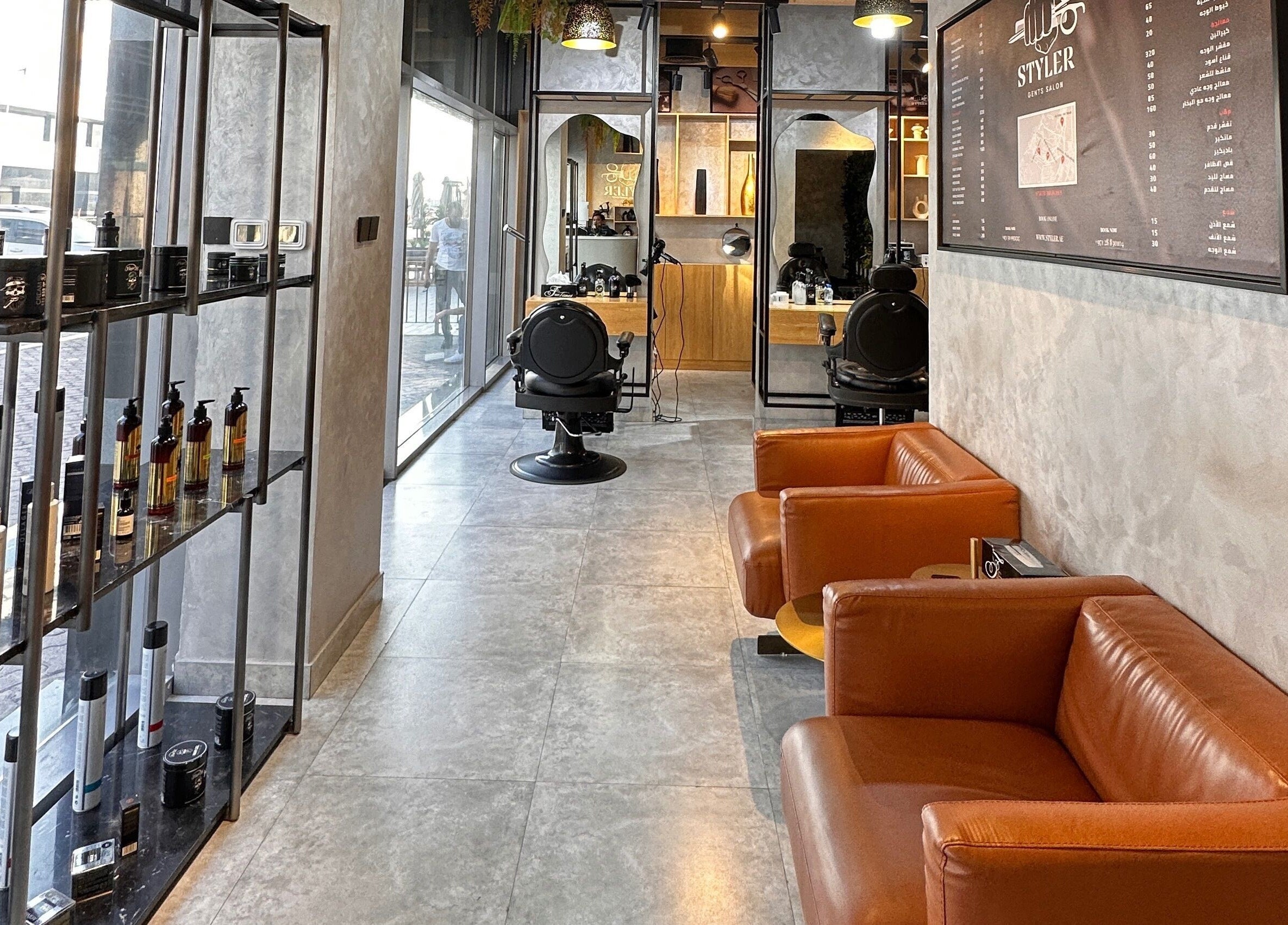 Cozy salon interior at Styler Gents Salon & Spa - Khalifa Park, Abu Dhabi, AE with sleek barber chairs.