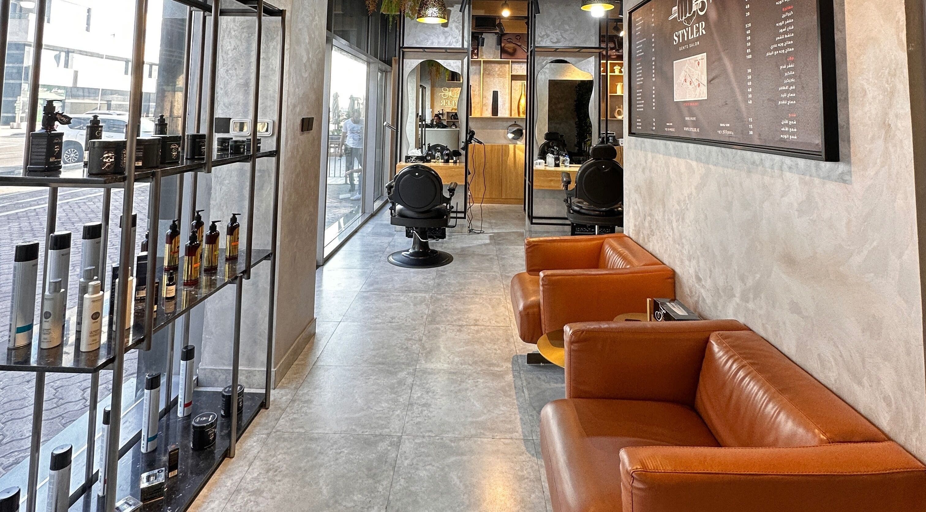 Cozy salon interior at Styler Gents Salon & Spa - Khalifa Park, Abu Dhabi, AE with sleek barber chairs.