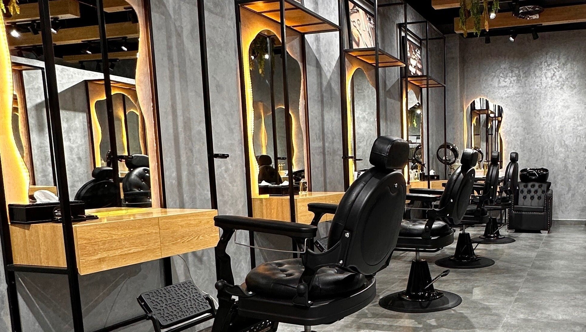 Stylish barber chairs at Styler Gents Salon and Spa - Rabdan Area, Abu Dhabi, AE.