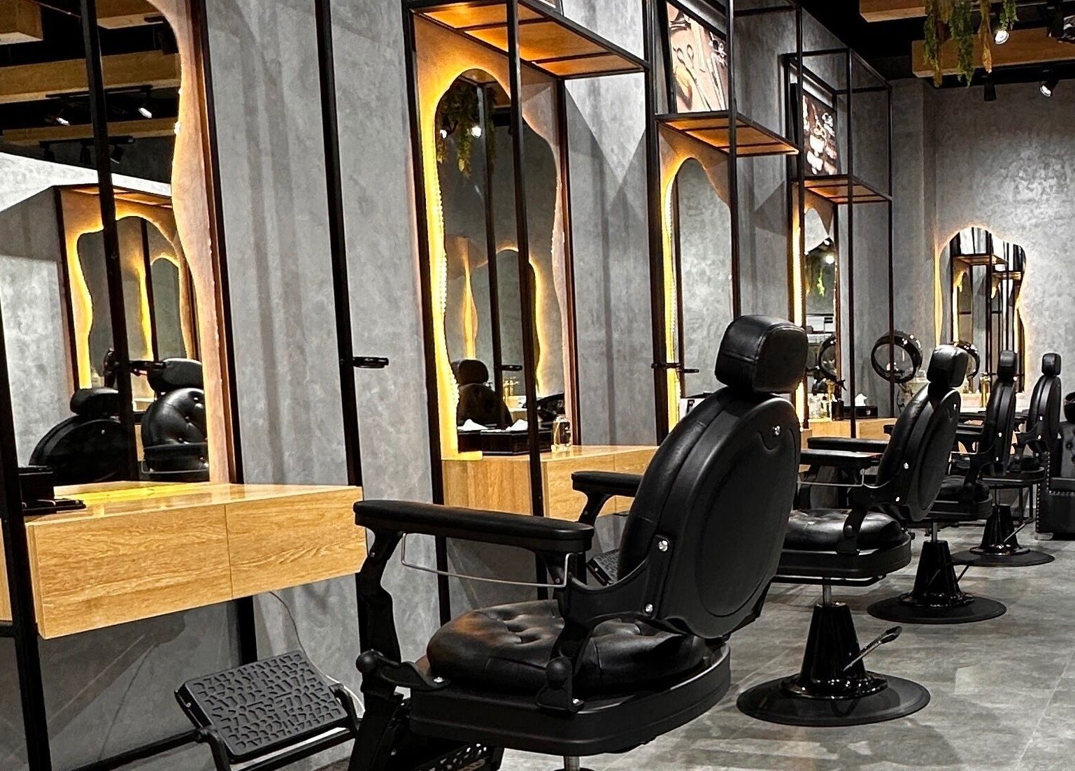 Stylish barber chairs at Styler Gents Salon and Spa - Rabdan Area, Abu Dhabi, AE.