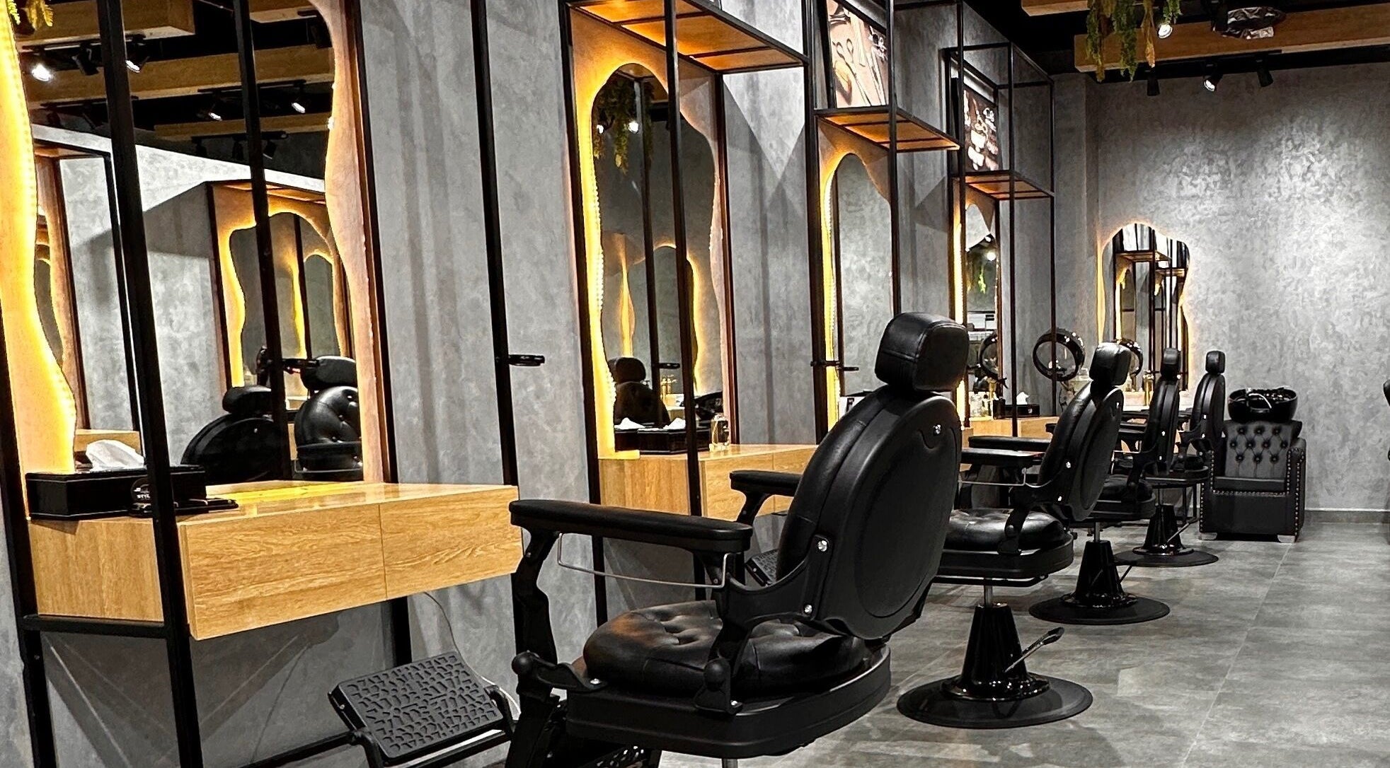 Stylish barber chairs at Styler Gents Salon and Spa - Rabdan Area, Abu Dhabi, AE.