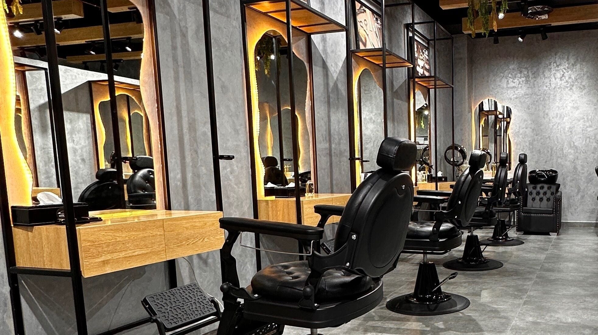 Stylish barber chairs at Styler Gents Salon and Spa - Rabdan Area, Abu Dhabi, AE.
