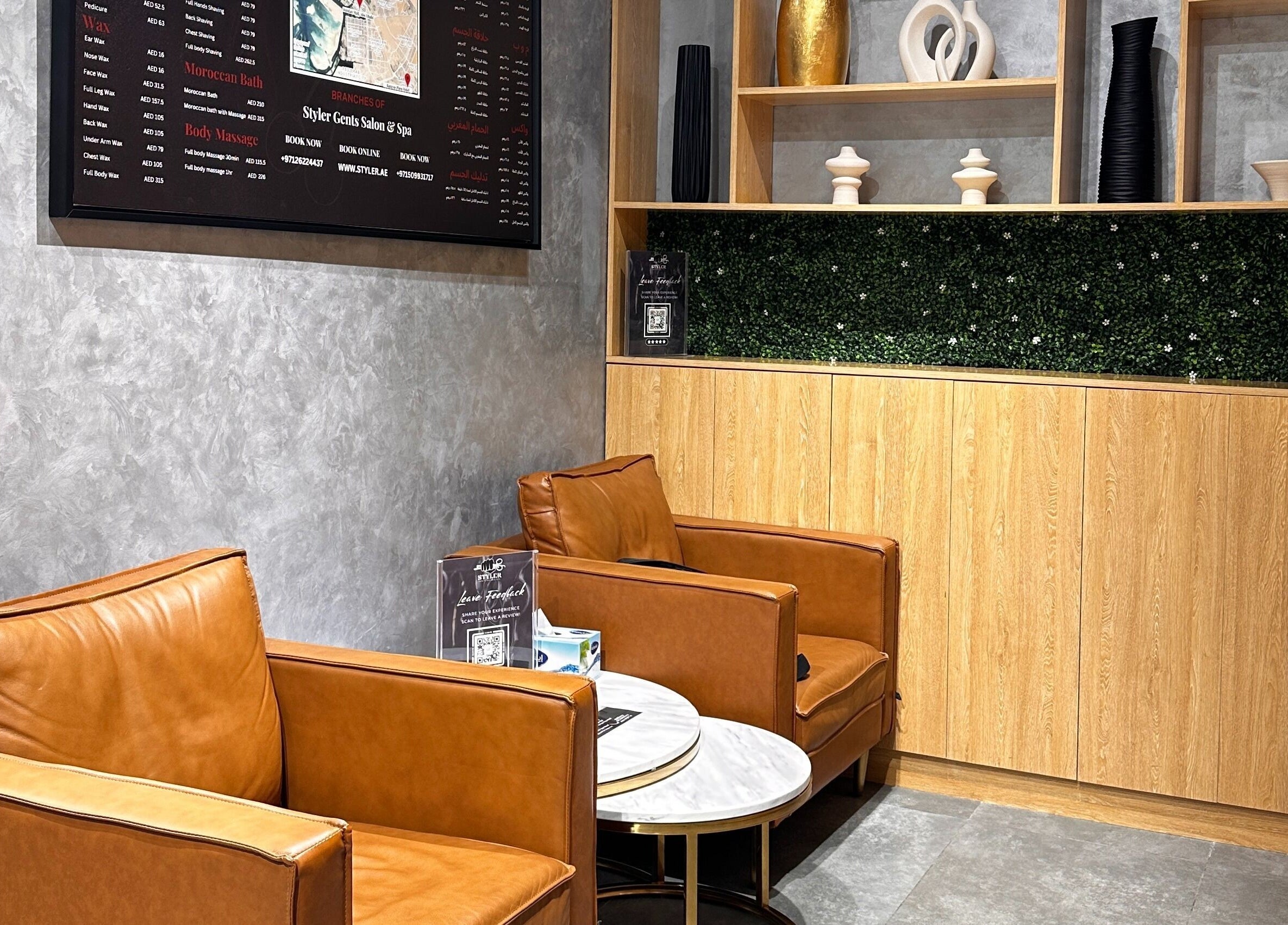 Stylish waiting area at Styler Gents Salon and Spa - Rabdan Area, Abu Dhabi, AE with leather chairs.