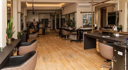 Modern salon interior at Excentric On Kloof, Cape Town, Western Cape, ZA showcasing sleek styling stations.
