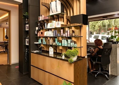 Modern reception area with beauty products at Excentric On Kloof, Cape Town, Western Cape, ZA.