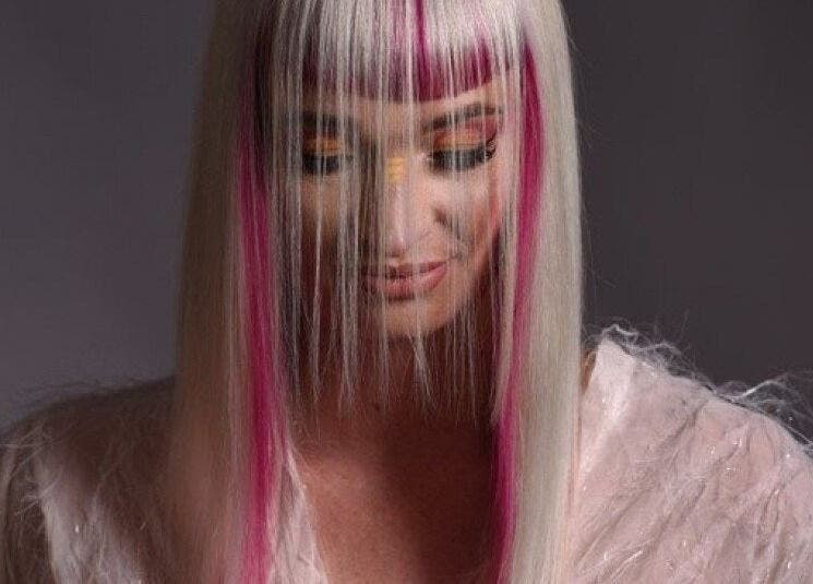 Stylish woman with bright hair and makeup at Excentric On Kloof, Cape Town, Western Cape, ZA.