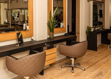 Modern hair salon at Excentric, Cape Town, Western Cape, ZA with sleek styling stations and comfortable chairs.