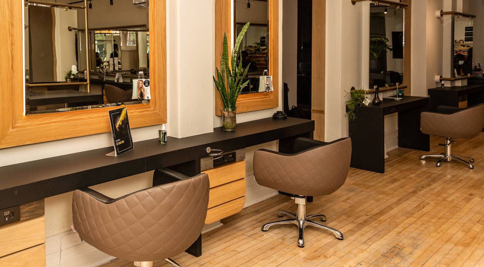 Modern hair salon at Excentric, Cape Town, Western Cape, ZA with sleek styling stations and comfortable chairs.