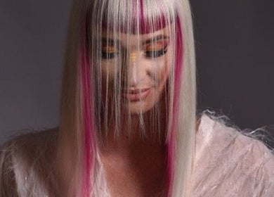 Stylish woman with pink-accented hair at Excentric, Cape Town, Western Cape, ZA.
