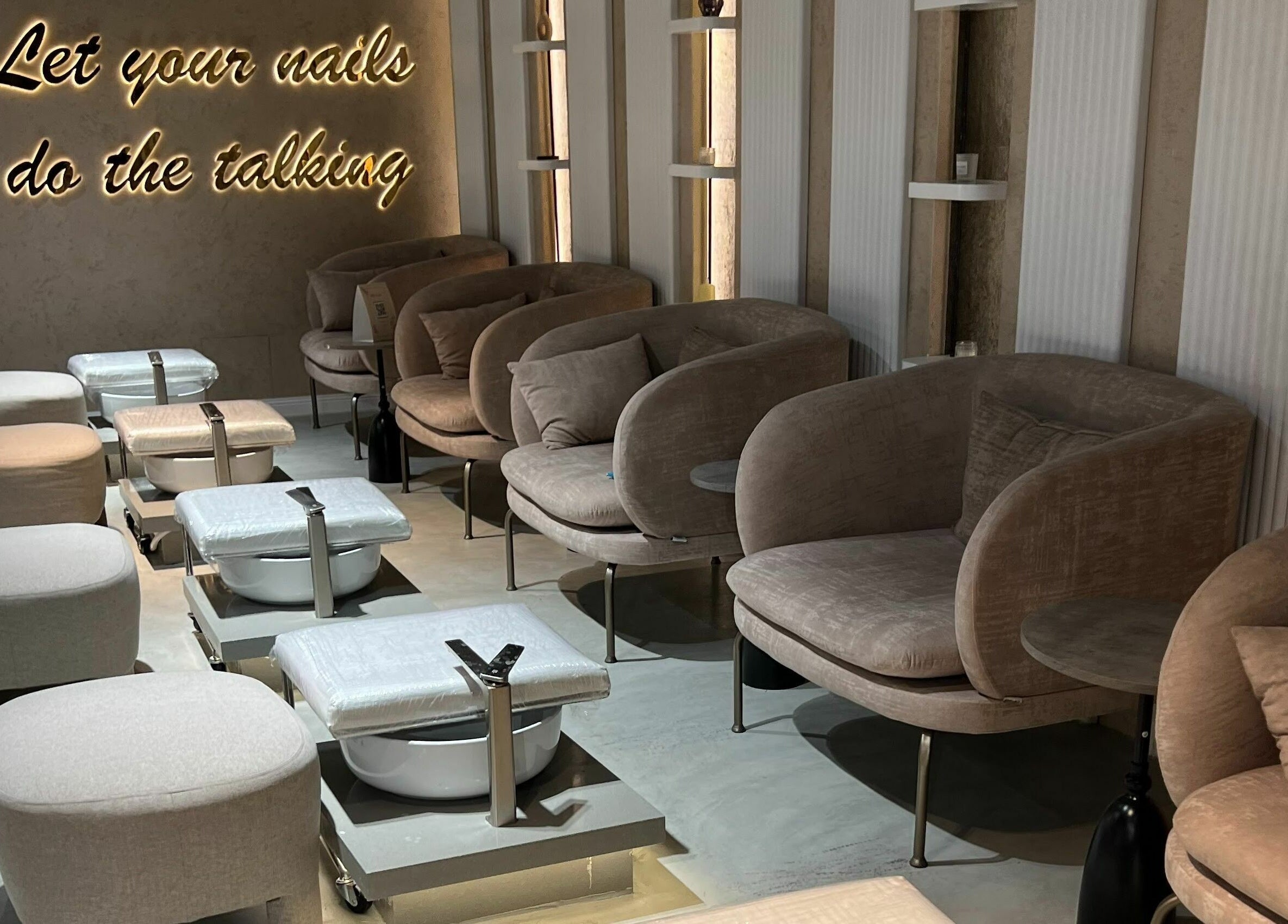 Luxurious nail lounge at Rawan Professional, Riyadh, Riyadh Province, SA, showcasing plush seating.