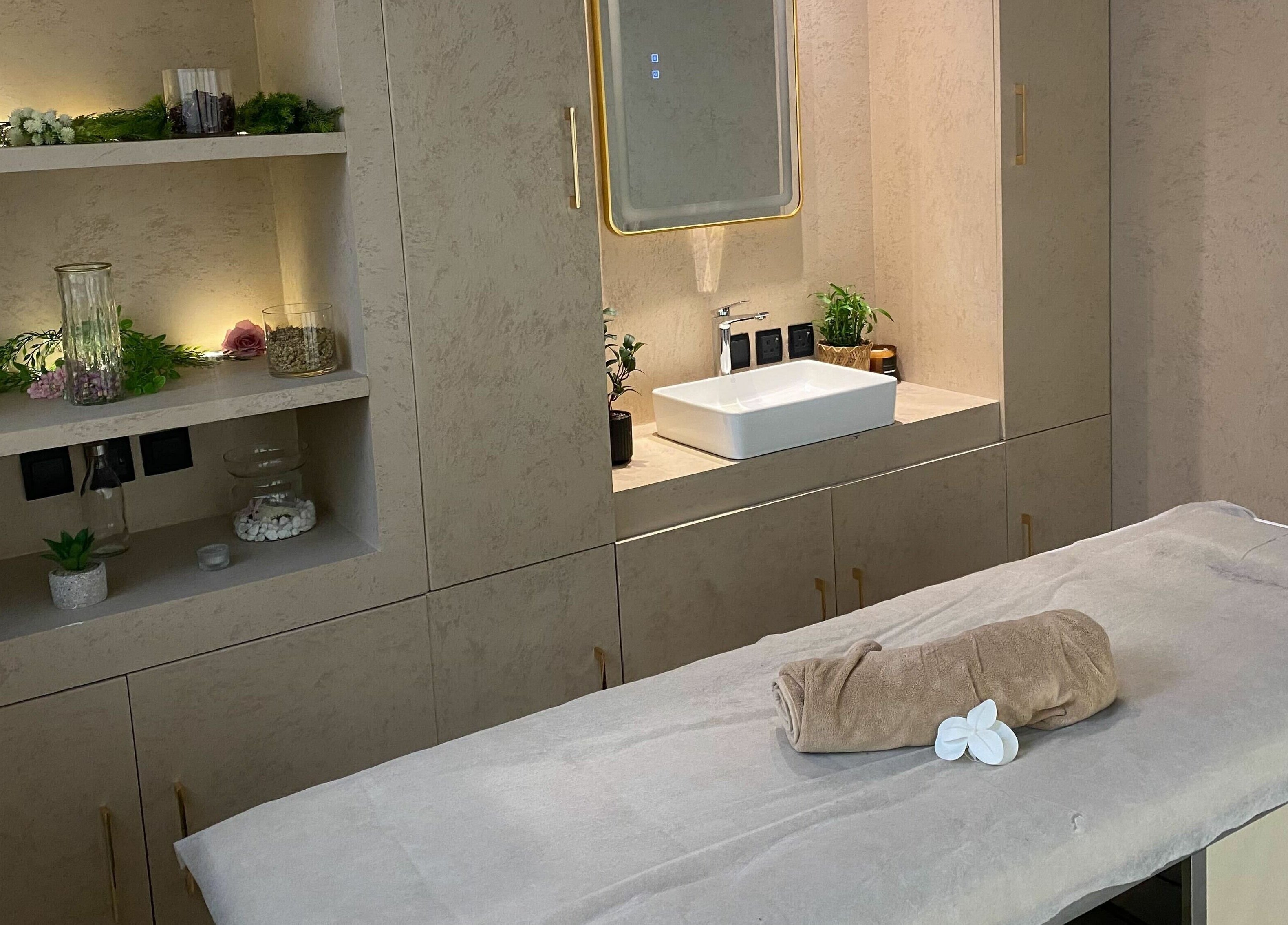 Elegant treatment room at Rawan Professional, Riyadh, Riyadh Province, SA, featuring a plush massage bed.