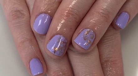 Beautiful lavender nails with gold accents at Elegance Beauty, Wootton, England, GB.