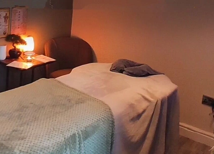 Relaxing therapy room at Elevate Therapies, Doncaster, England, GB, featuring a cozy treatment bed with soft lighting.