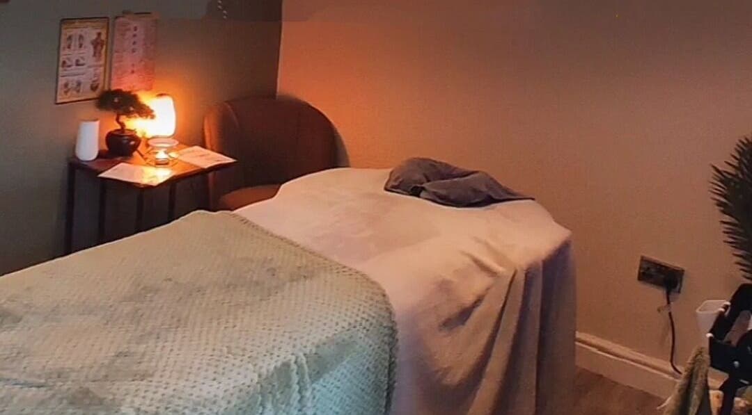 Relaxing therapy room at Elevate Therapies, Doncaster, England, GB, featuring a cozy treatment bed with soft lighting.