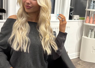 Woman with long blonde hair at Hair by Liv, Stamford, England, GB.