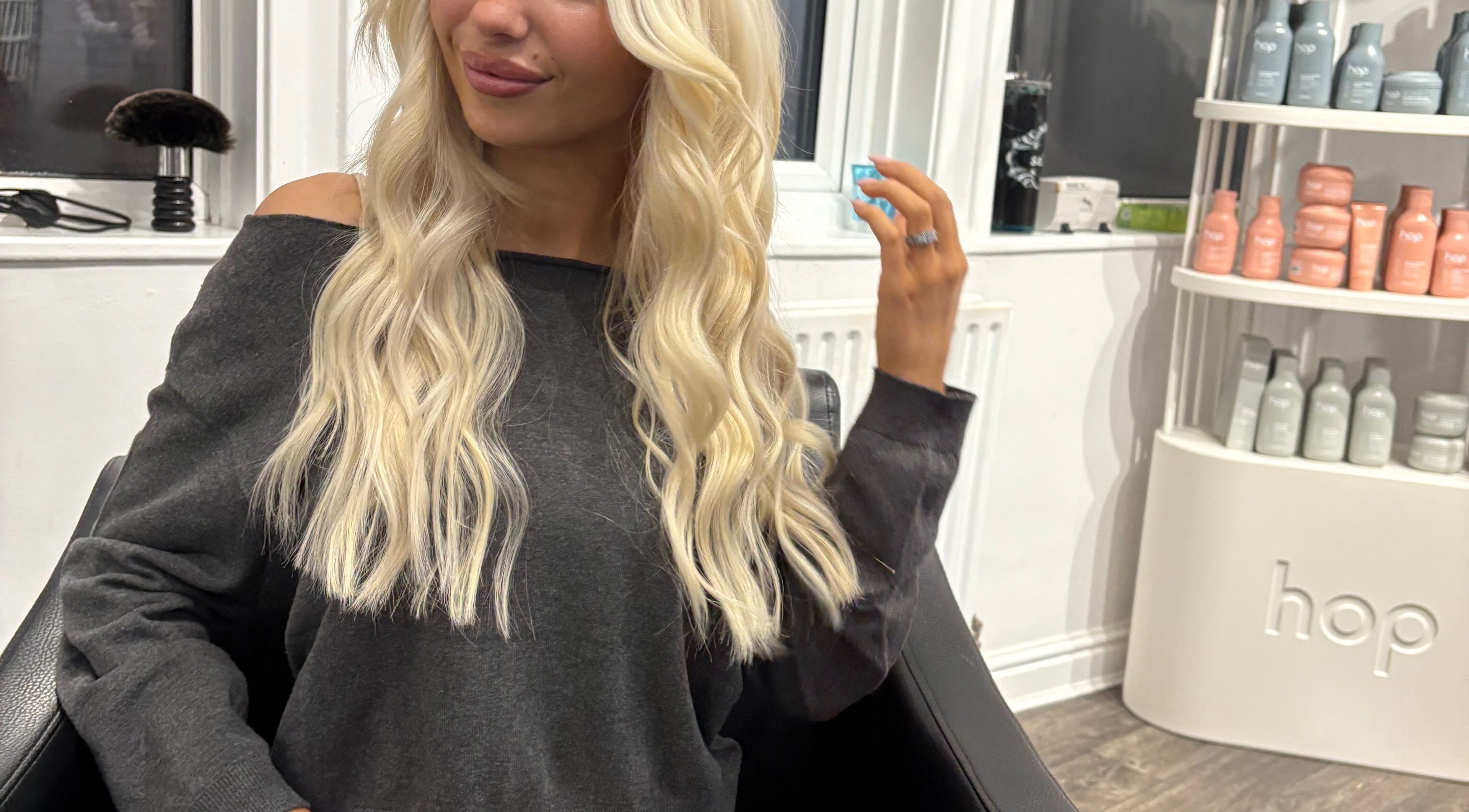 Woman with long blonde hair at Hair by Liv, Stamford, England, GB.