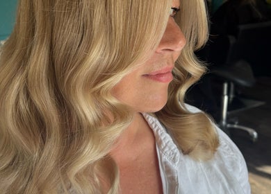 Elegant blonde waves styled at Hair by Liv in Stamford, England, GB.