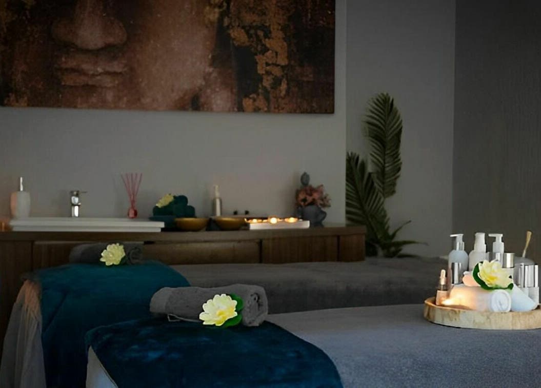 Tranquil treatment room at Oasis Spa Therapy in WORTHING, England, GB with soothing candles and plush towels.