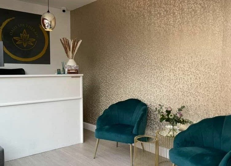 Reception area of Oasis Spa Therapy in WORTHING, England, GB with elegant decor and plush chairs.